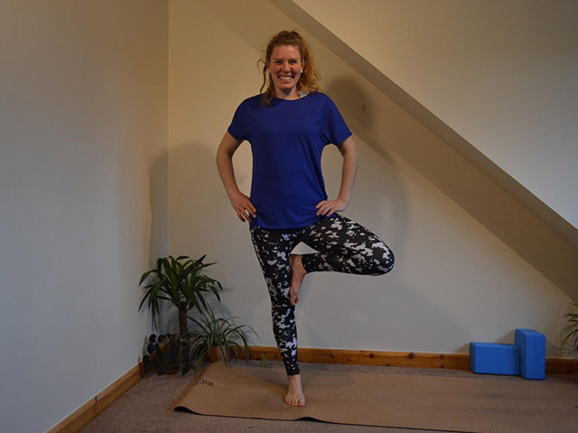 A photoo of Laura in tree pose