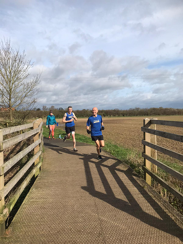Ed and Nick run over a bridge during the MtM spring challenge
